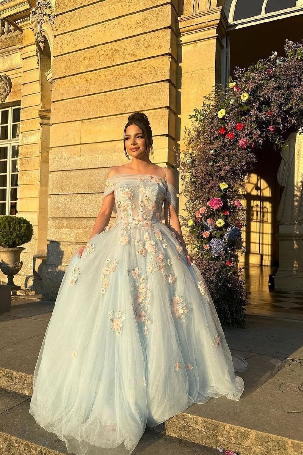 woman posing in a princess floral dress