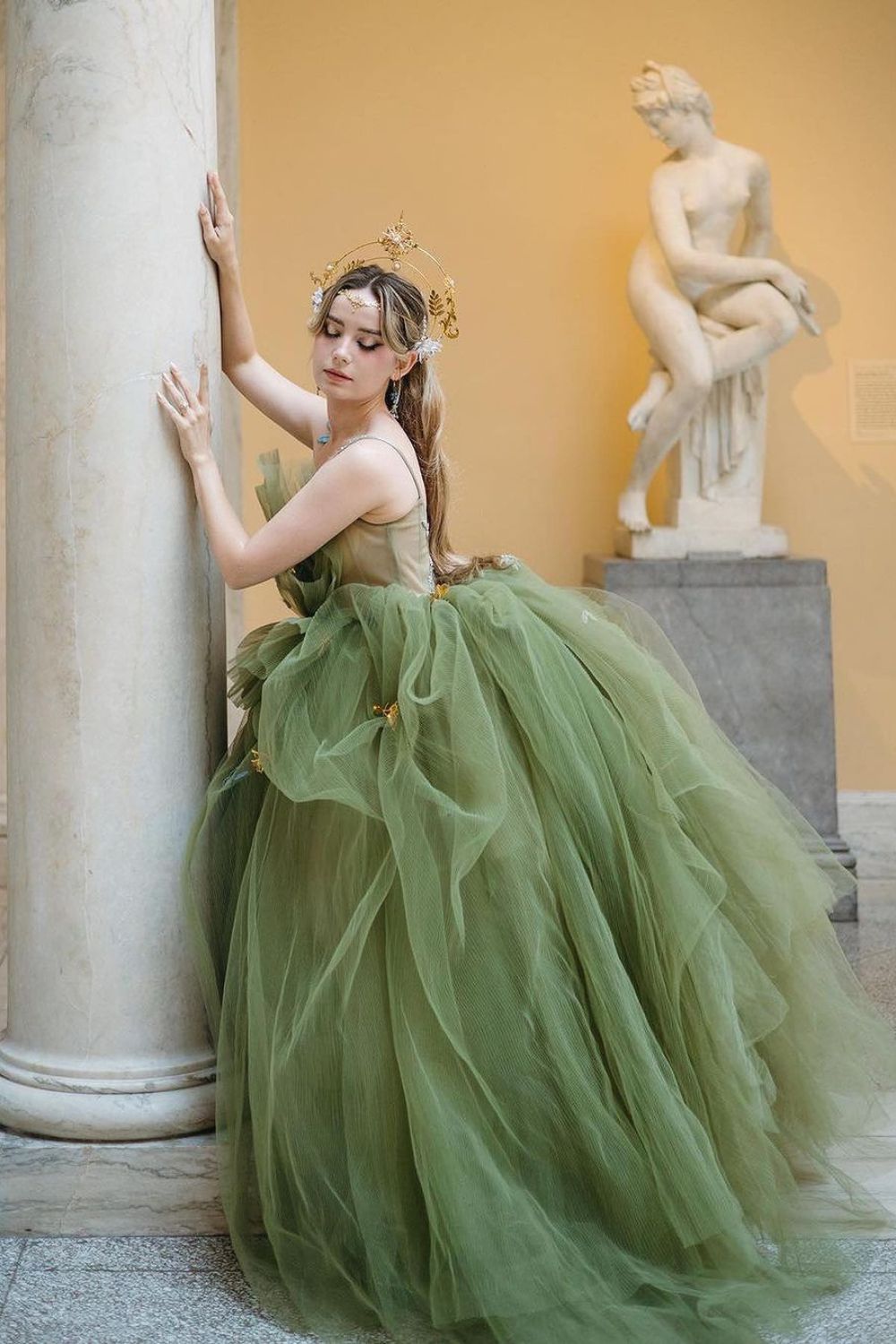 woman posing in green ball dress