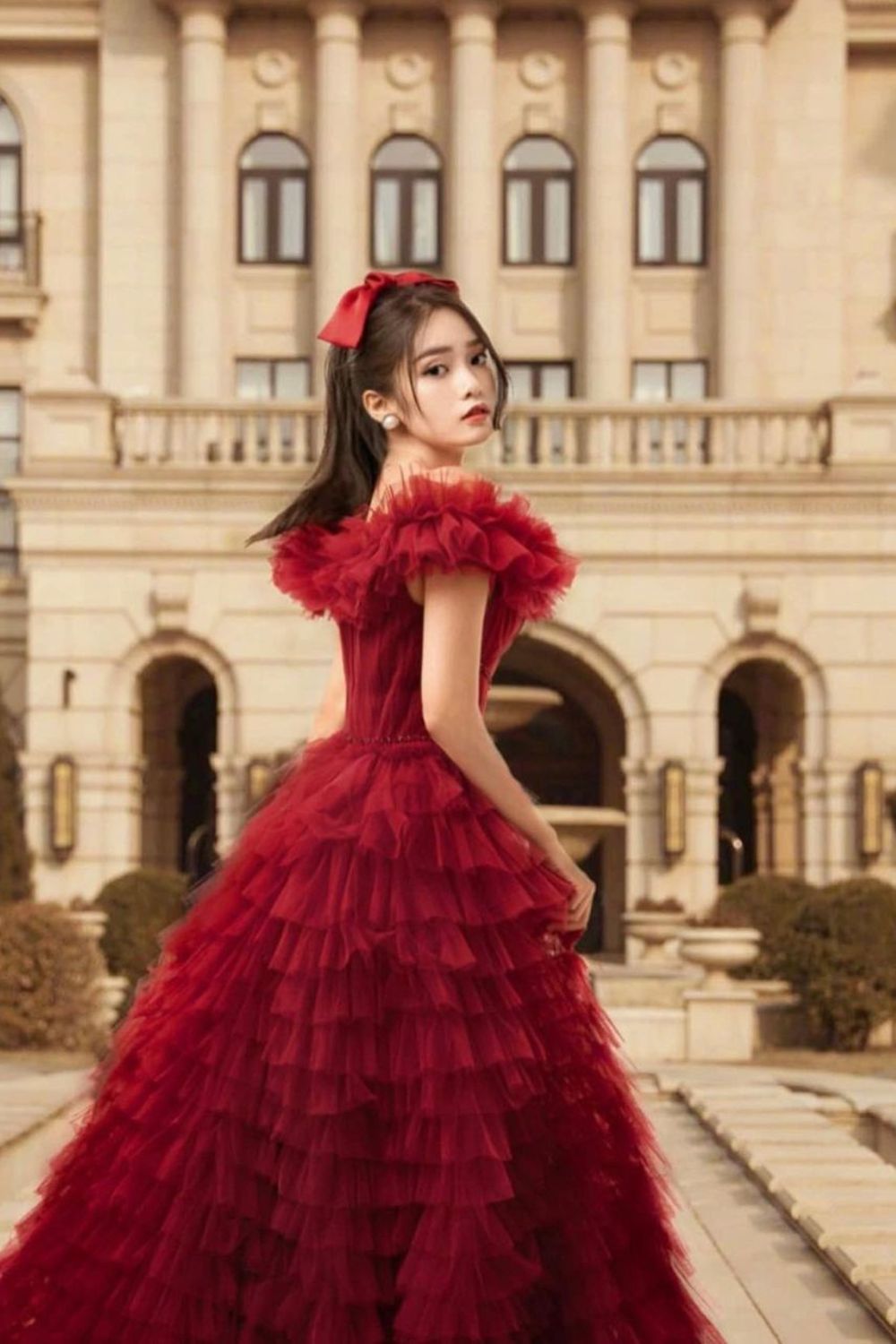 woman wearing huge red dress with frills