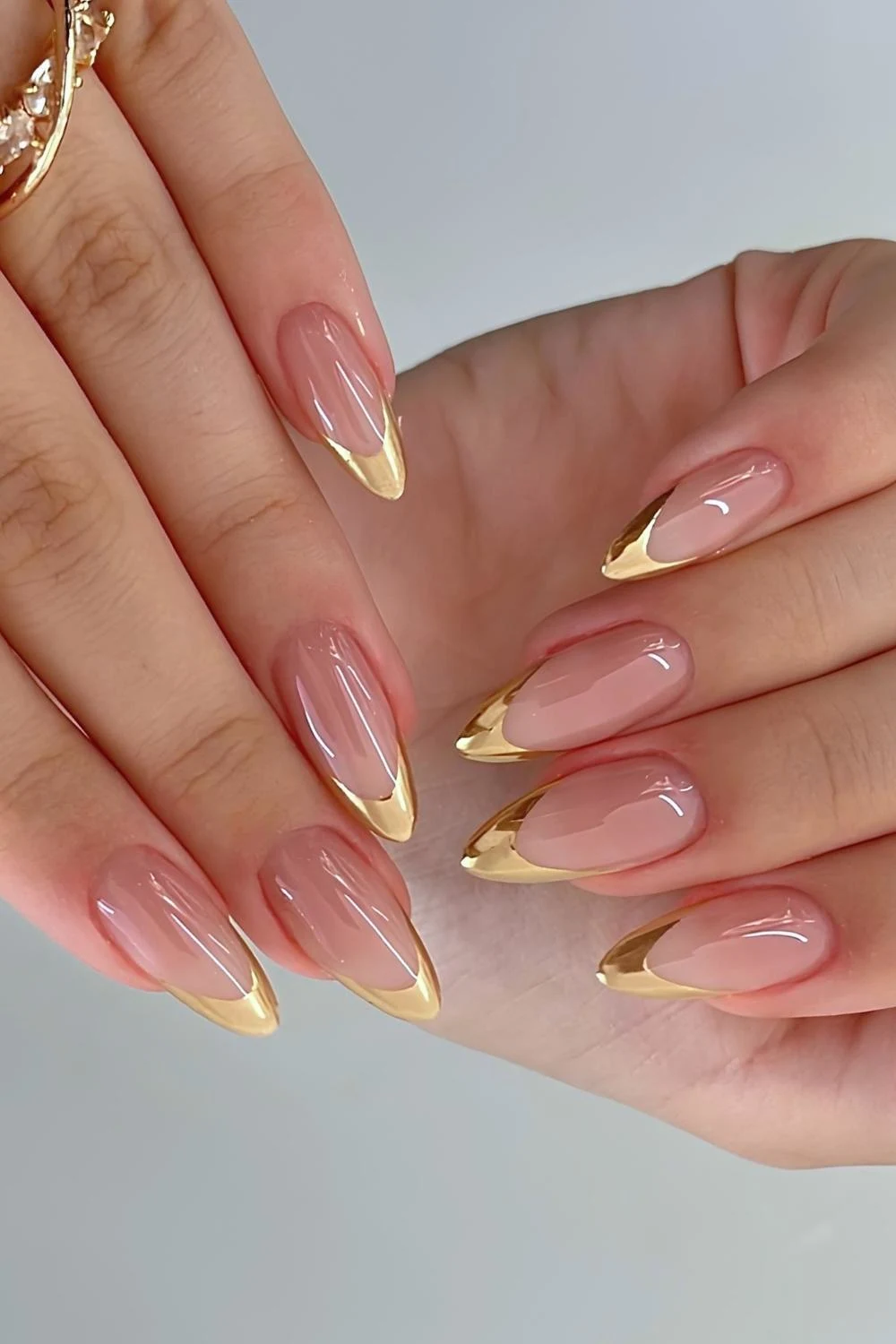 Almond shaped gold french manicure