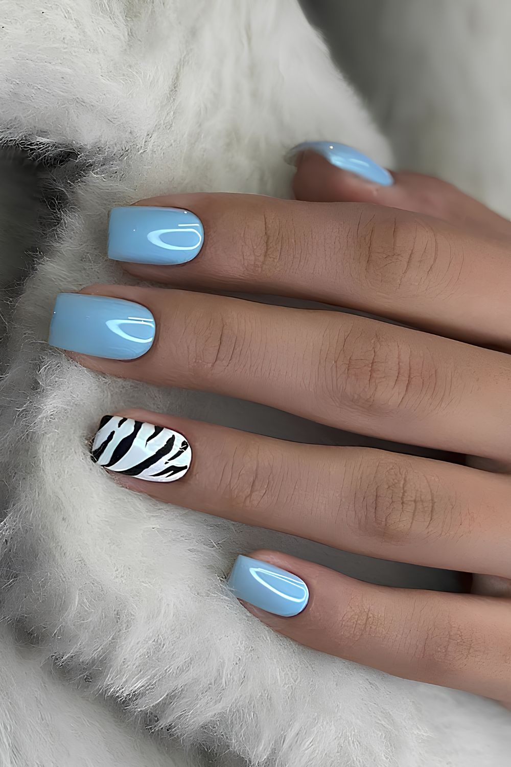 Baby blue mani with animal print accent