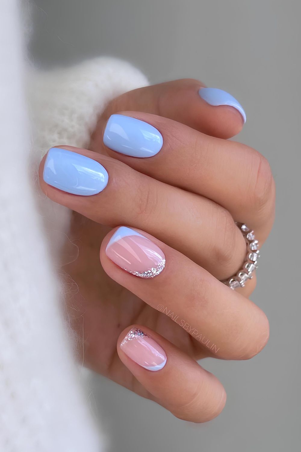 Baby blue nails with glitter details