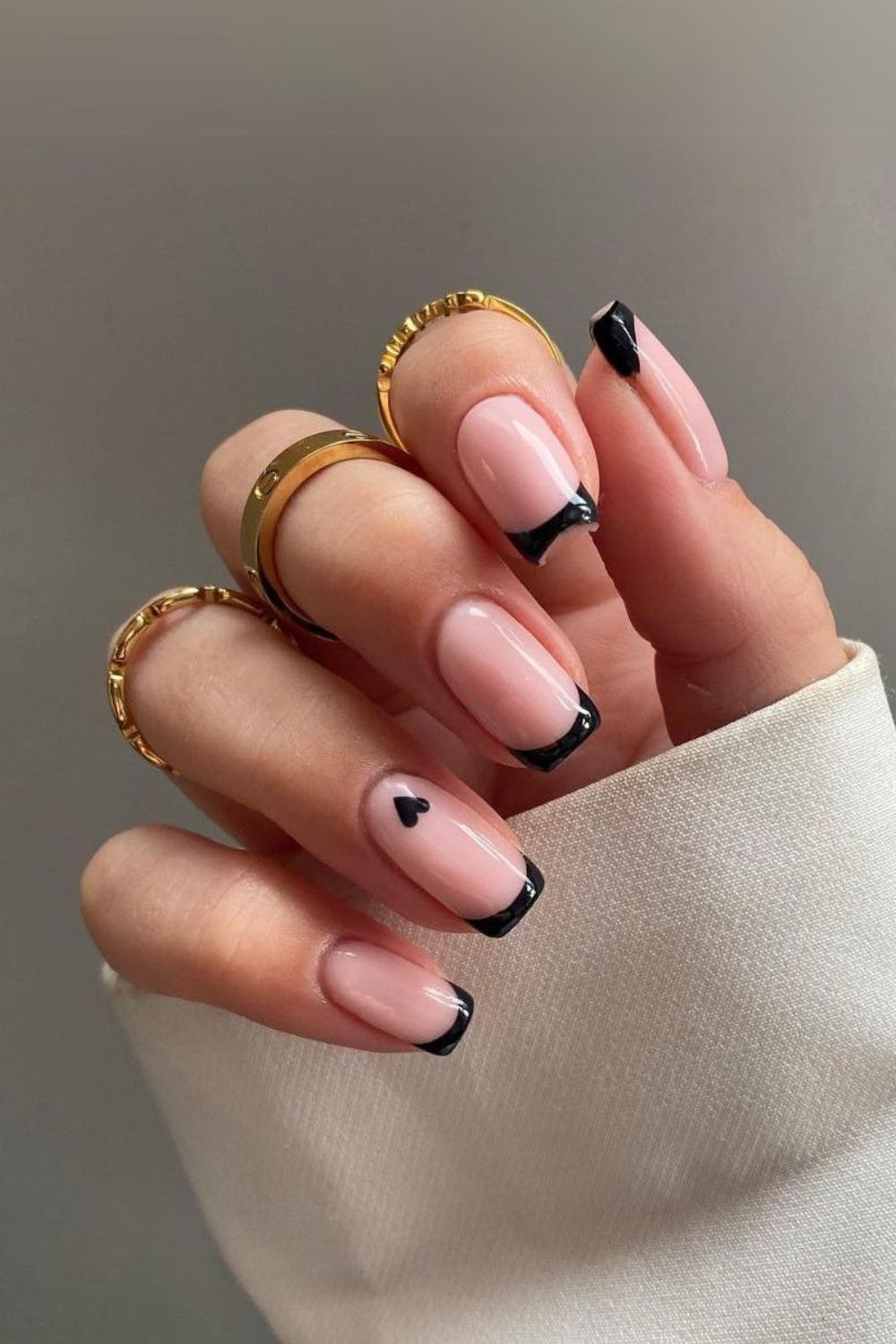 Black french nails with tiny heart detail