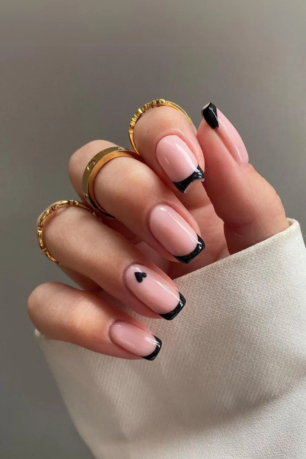 Black french nails with tiny heart detail