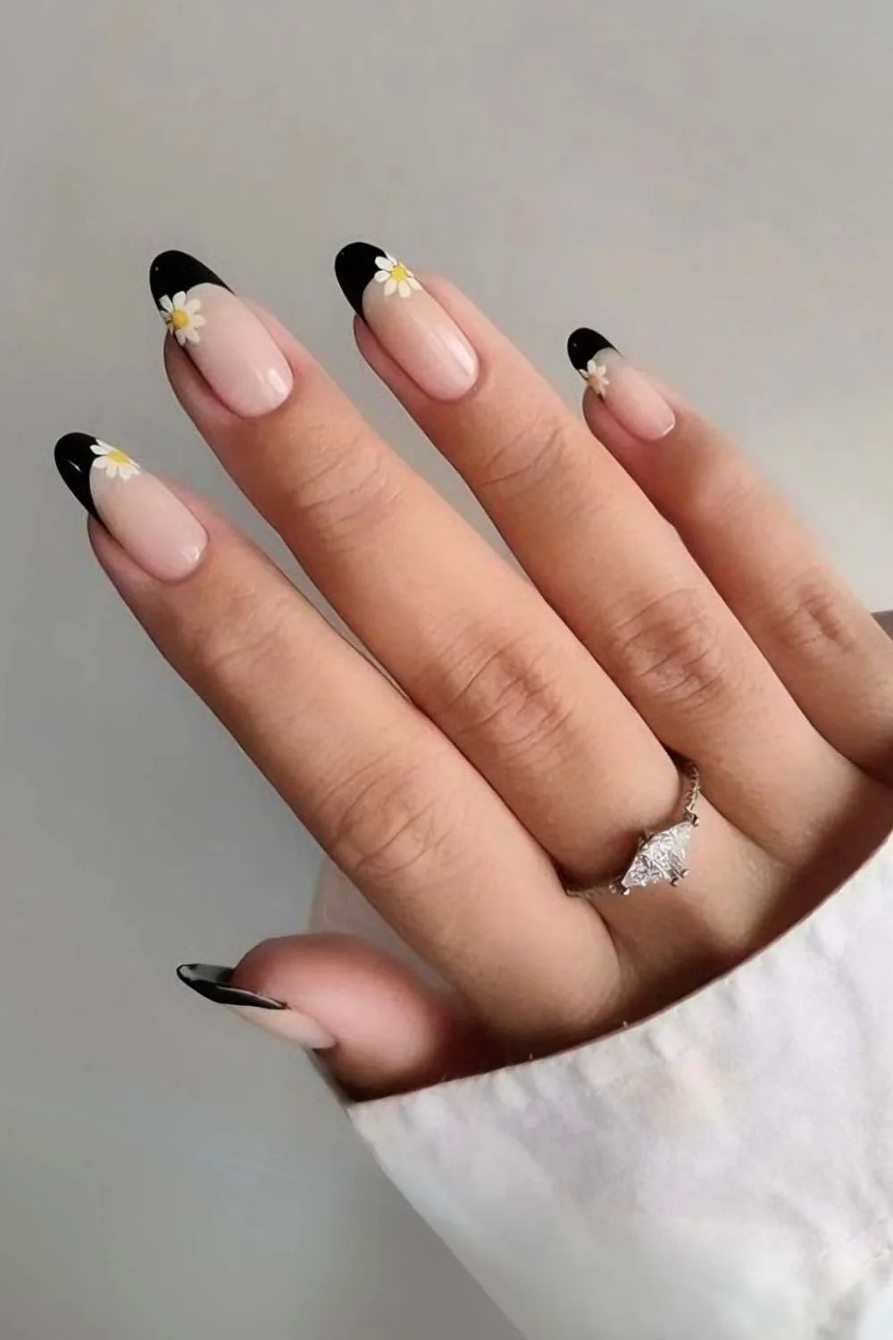 Black french tips with daisy accents