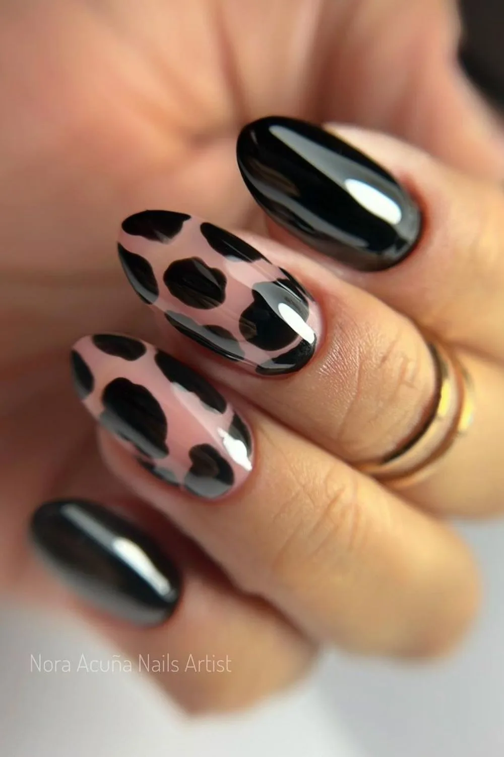 Black nails with cow prints