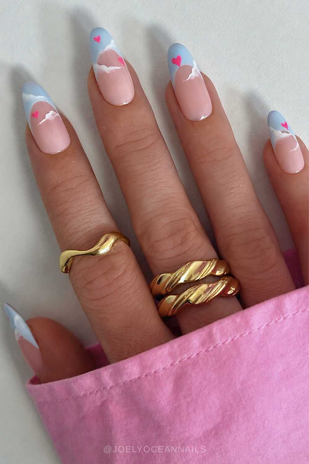 Blue French mani with pink hearts and cloud art
