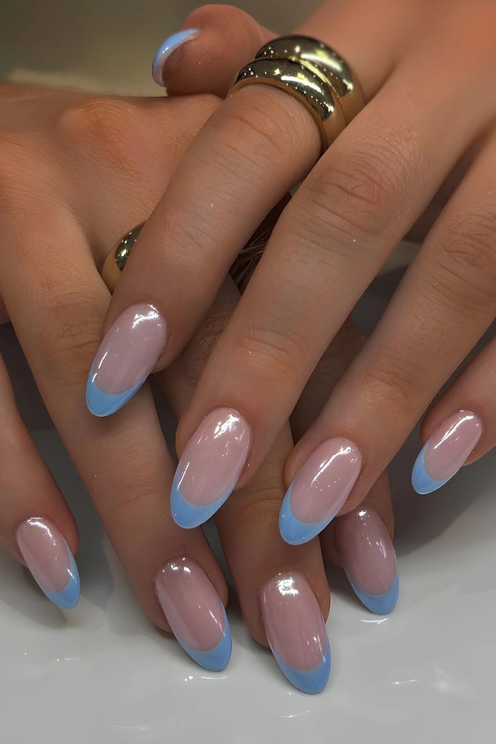 Blue French manicure with a chrome finish