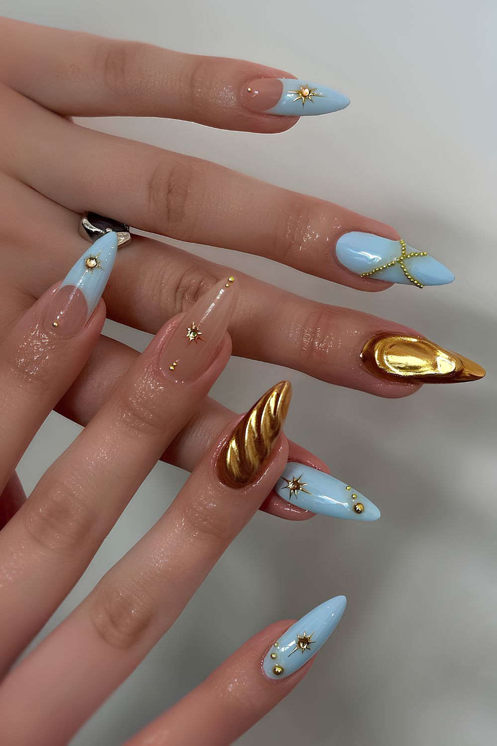 Blue and gold nails with 3D details