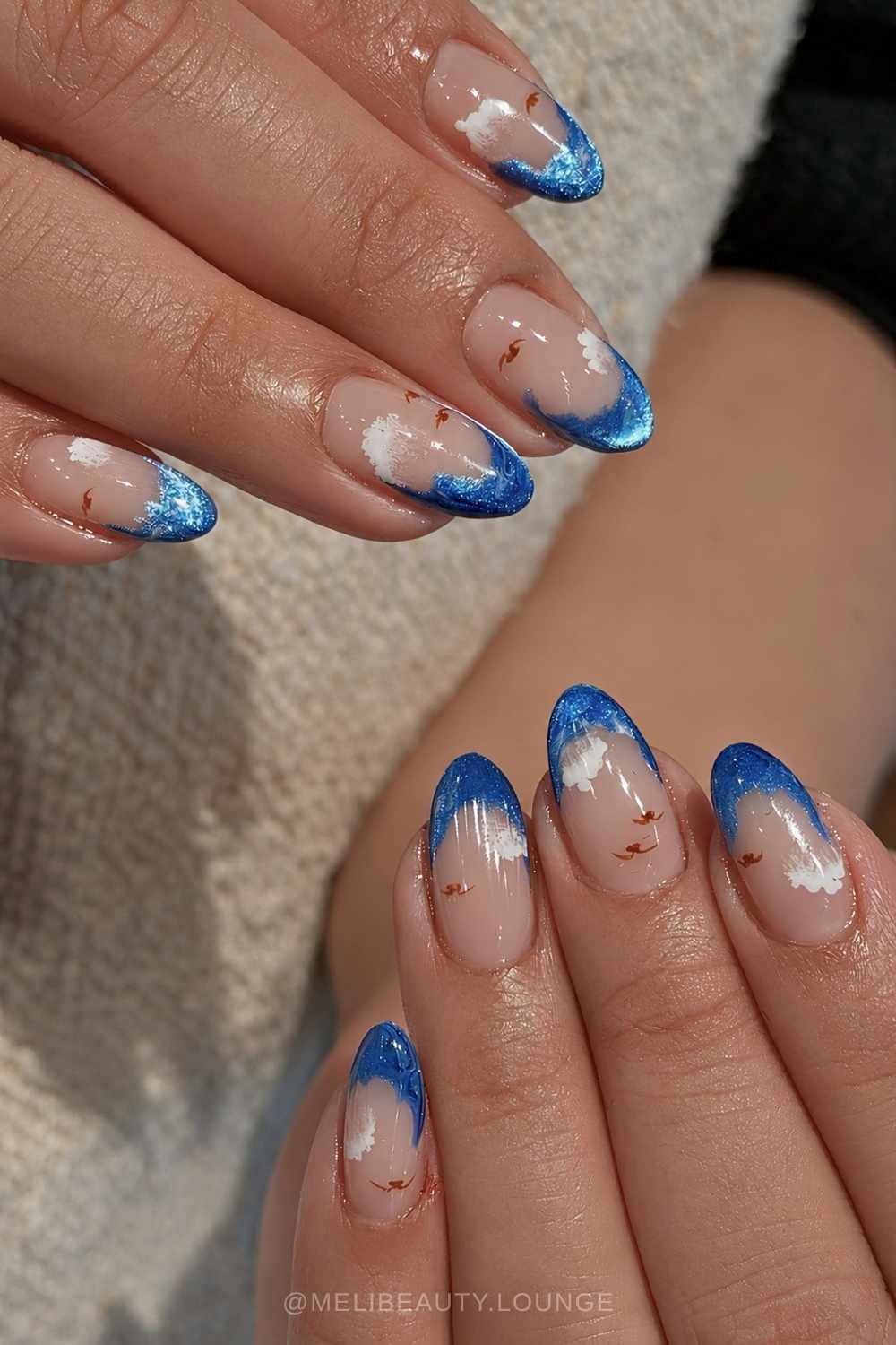 Blue cat eye French nails with cloud art