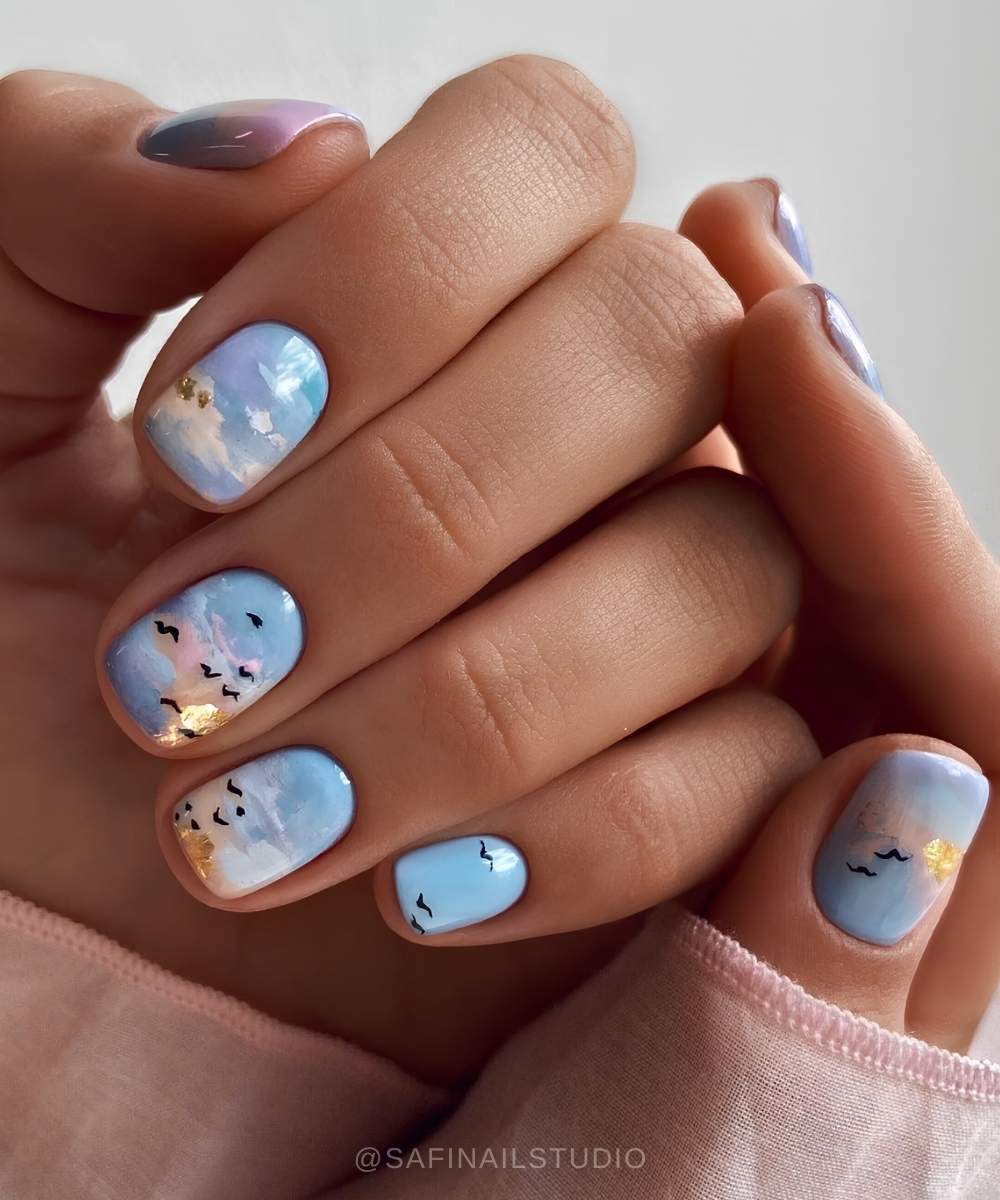 Blue cloud nails with micro bird art