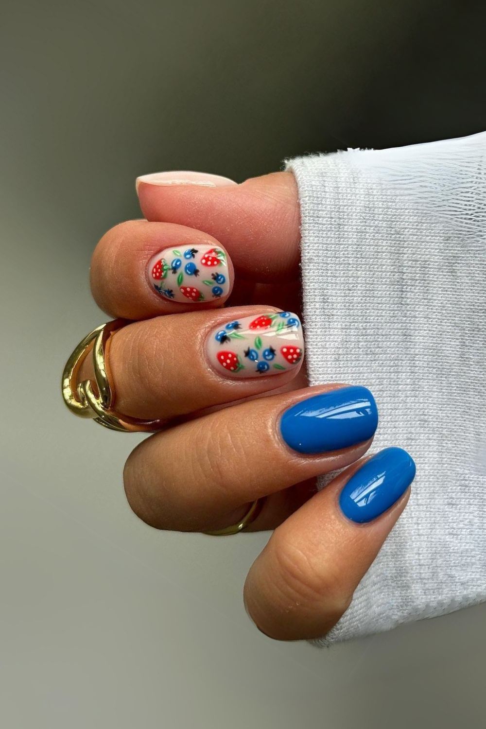 Blue nails with blueberries and strawberries