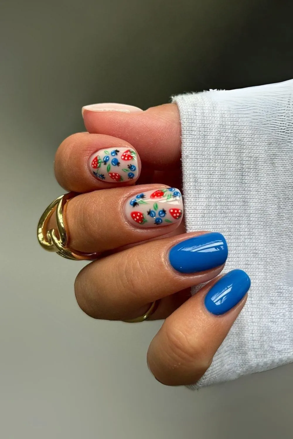 Blue nails with blueberries and strawberries