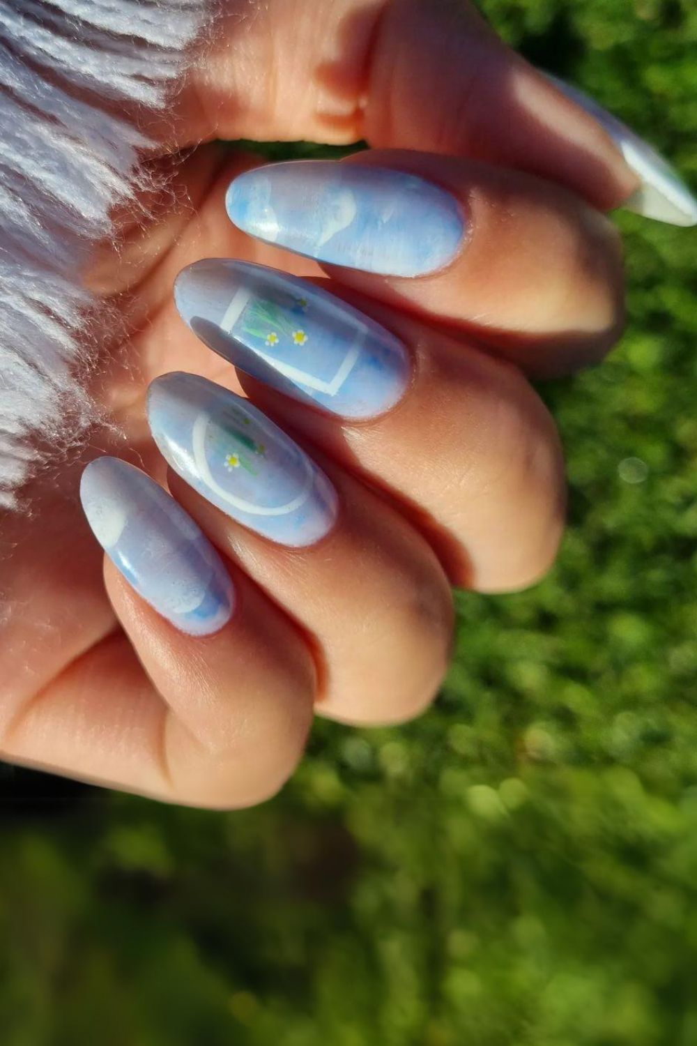 Blue nails with clouds and daisies