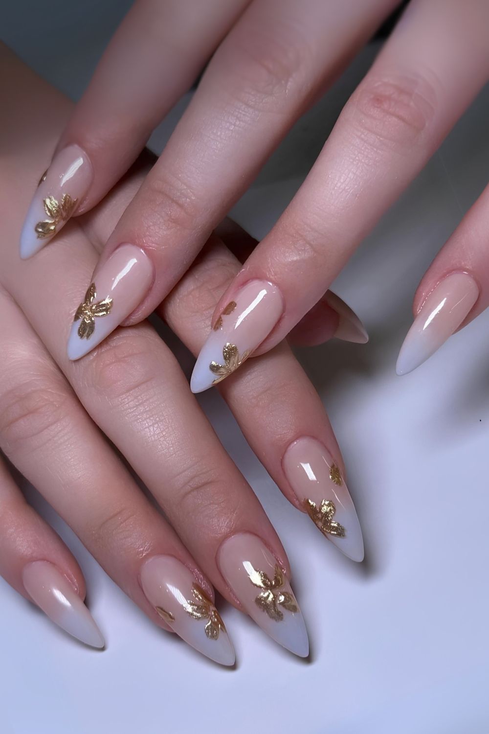 Blue ombe nails with gold flower art