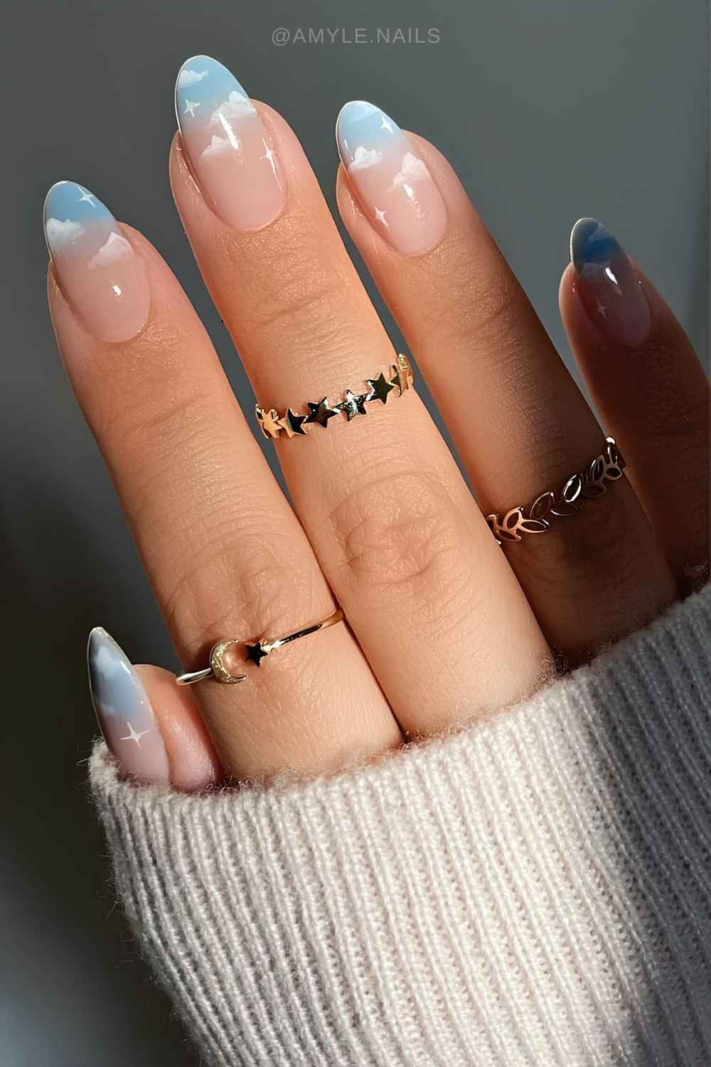 Blue ombre manicure with micro cloud art