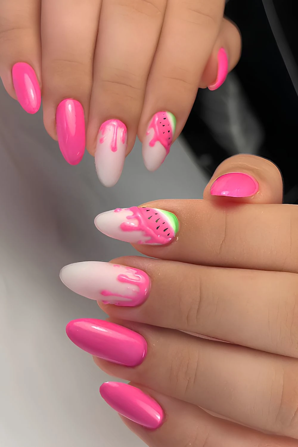 Bright pink nails with watermelon drip art
