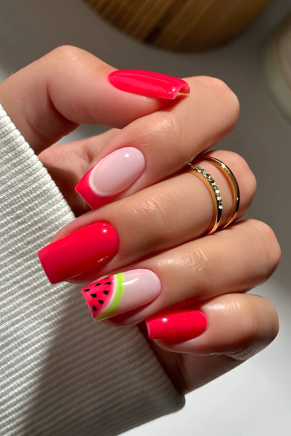 Bright red manicure with watermelon art