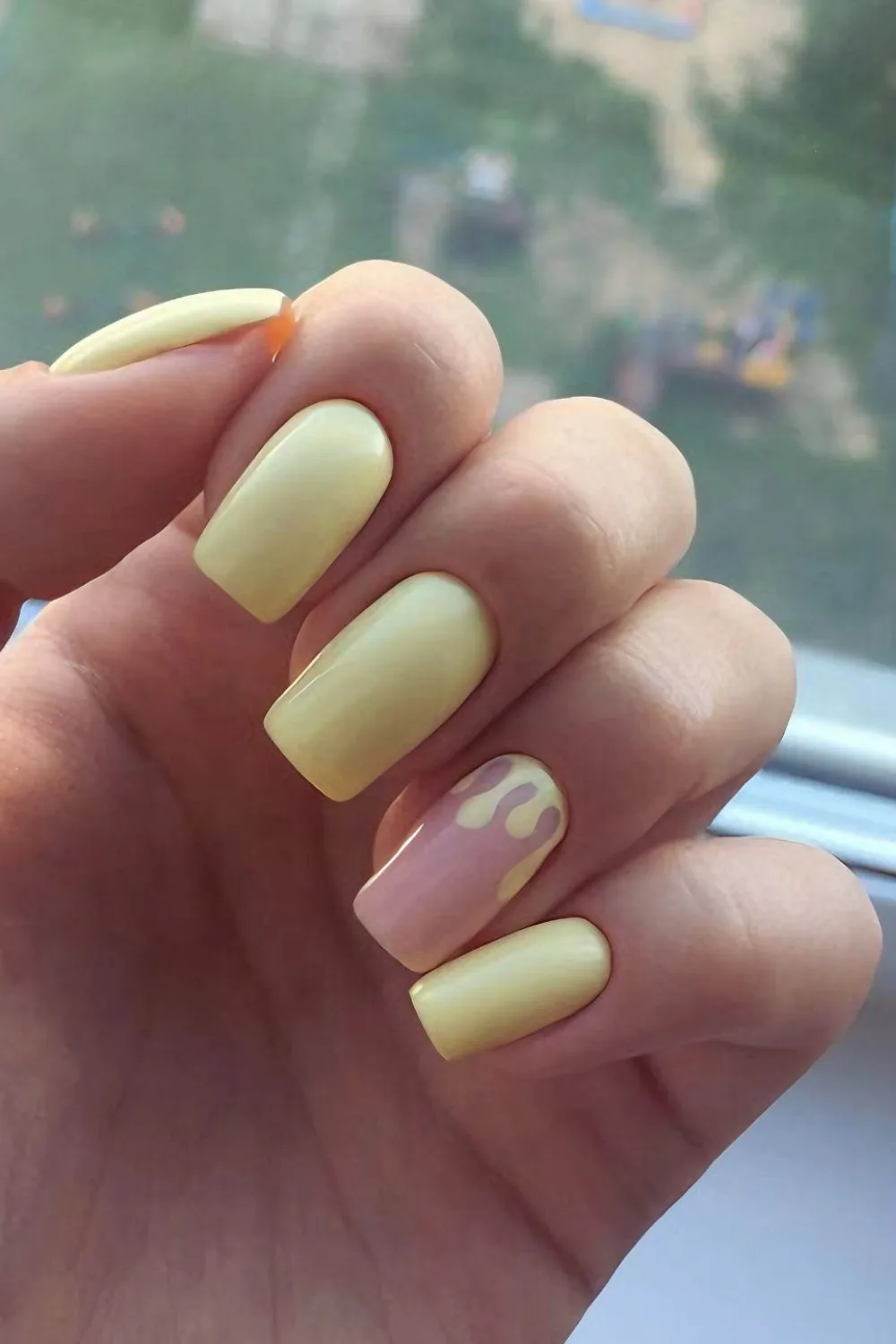 Butter yellow nails with drip accent