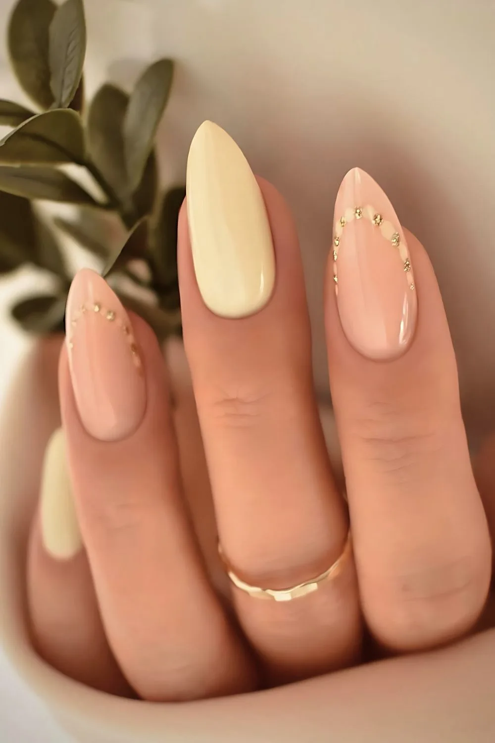 Butter yellow nails with gold studs