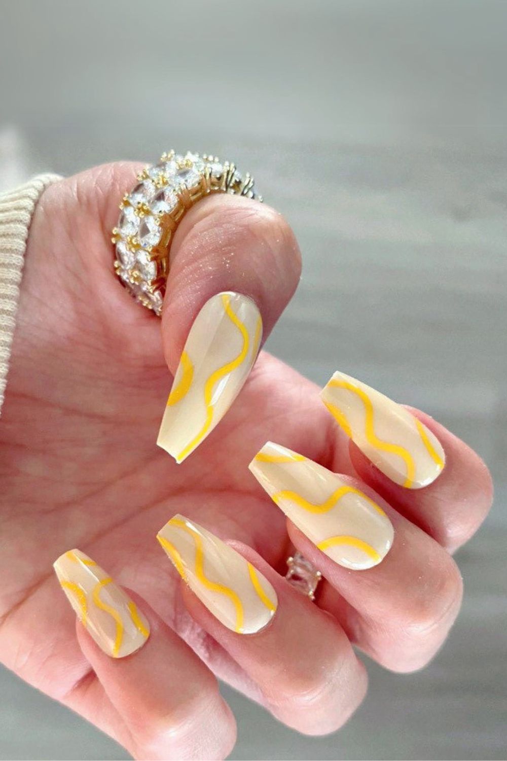 Butter yellow nails with swirls