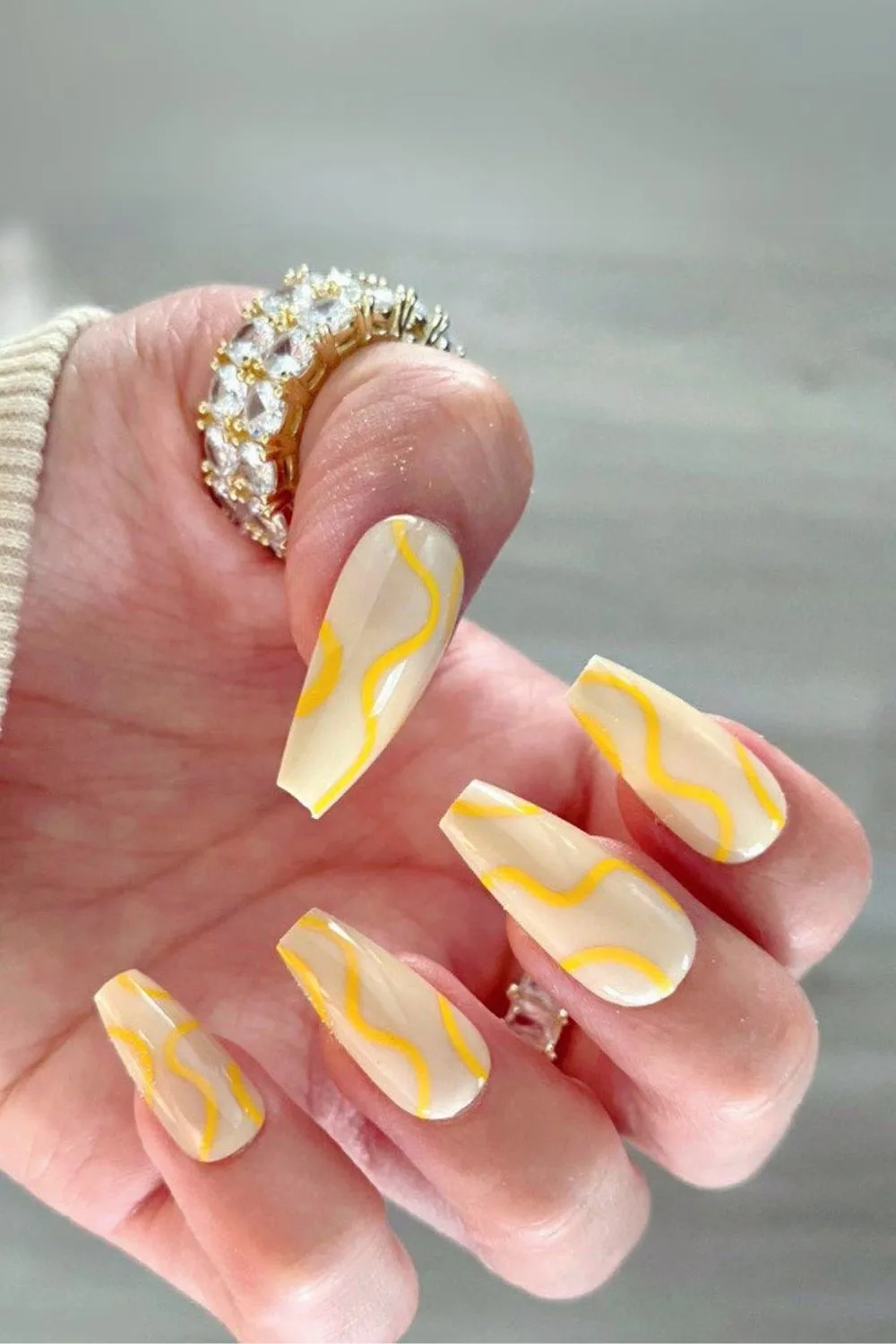 Butter yellow nails with swirls