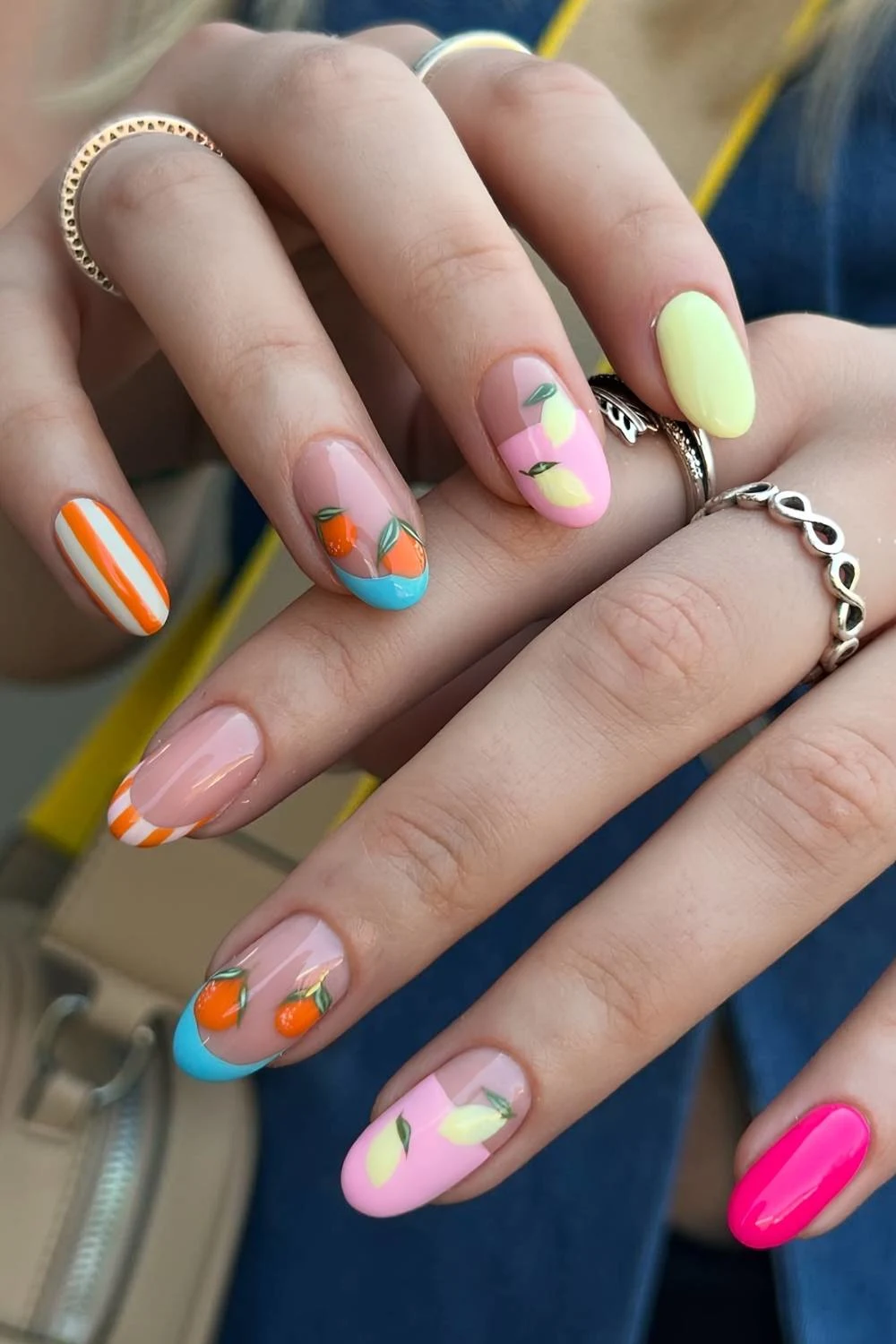 Colorful manicure with fruit and stripes