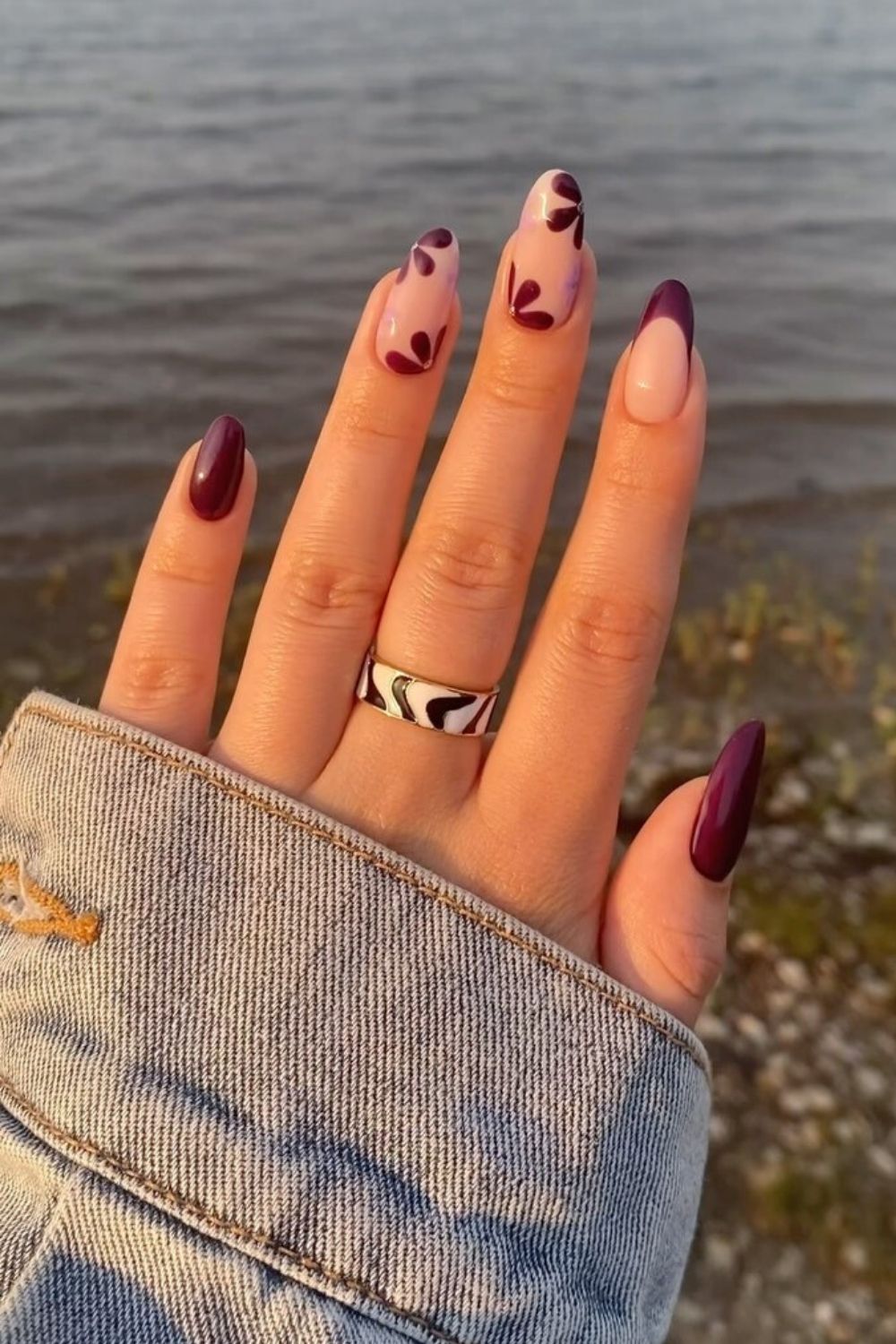 Dark purple nails with flowers