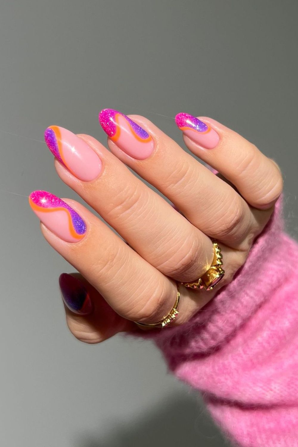 Glittery neon nails with negative space accents