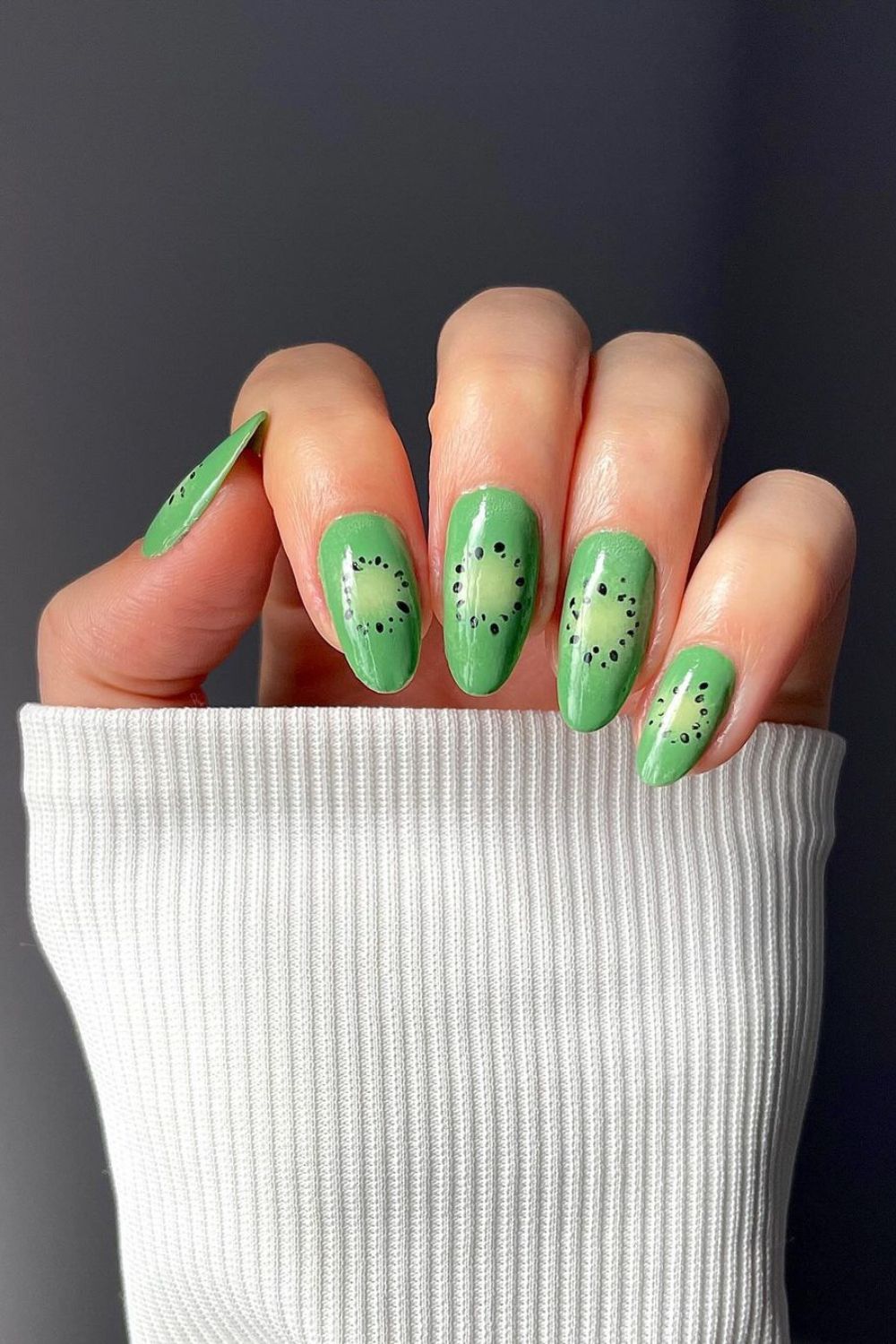 Green nails with kiwi aura design