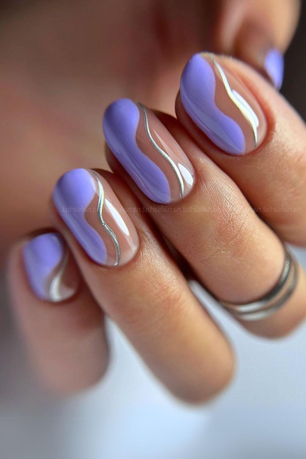 Lavander nails with silver swirls