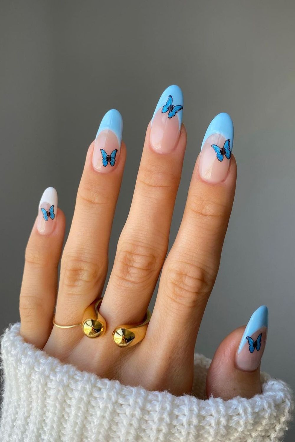 Light blue nails with butterflies