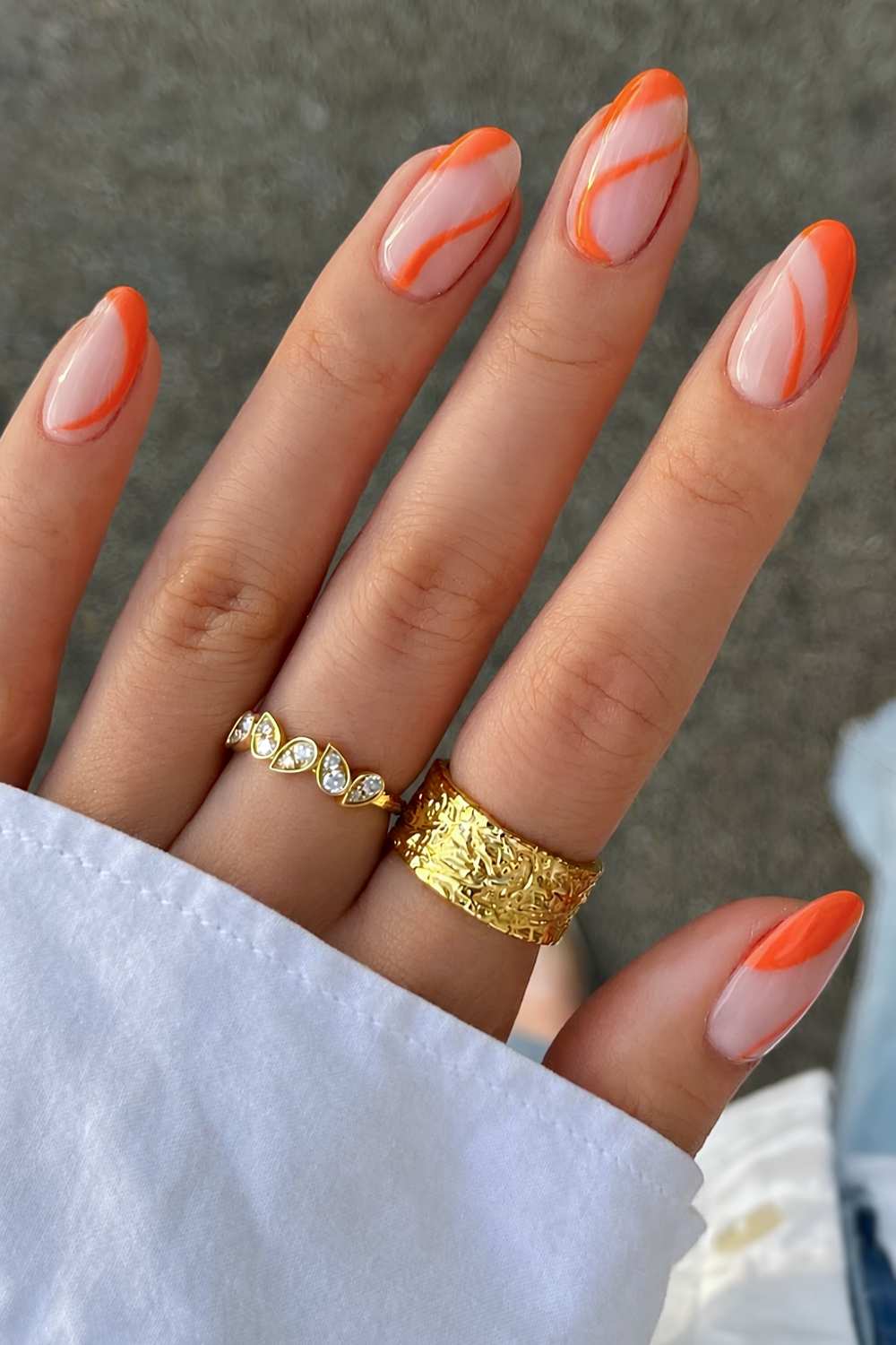 Milky nails with orange line art