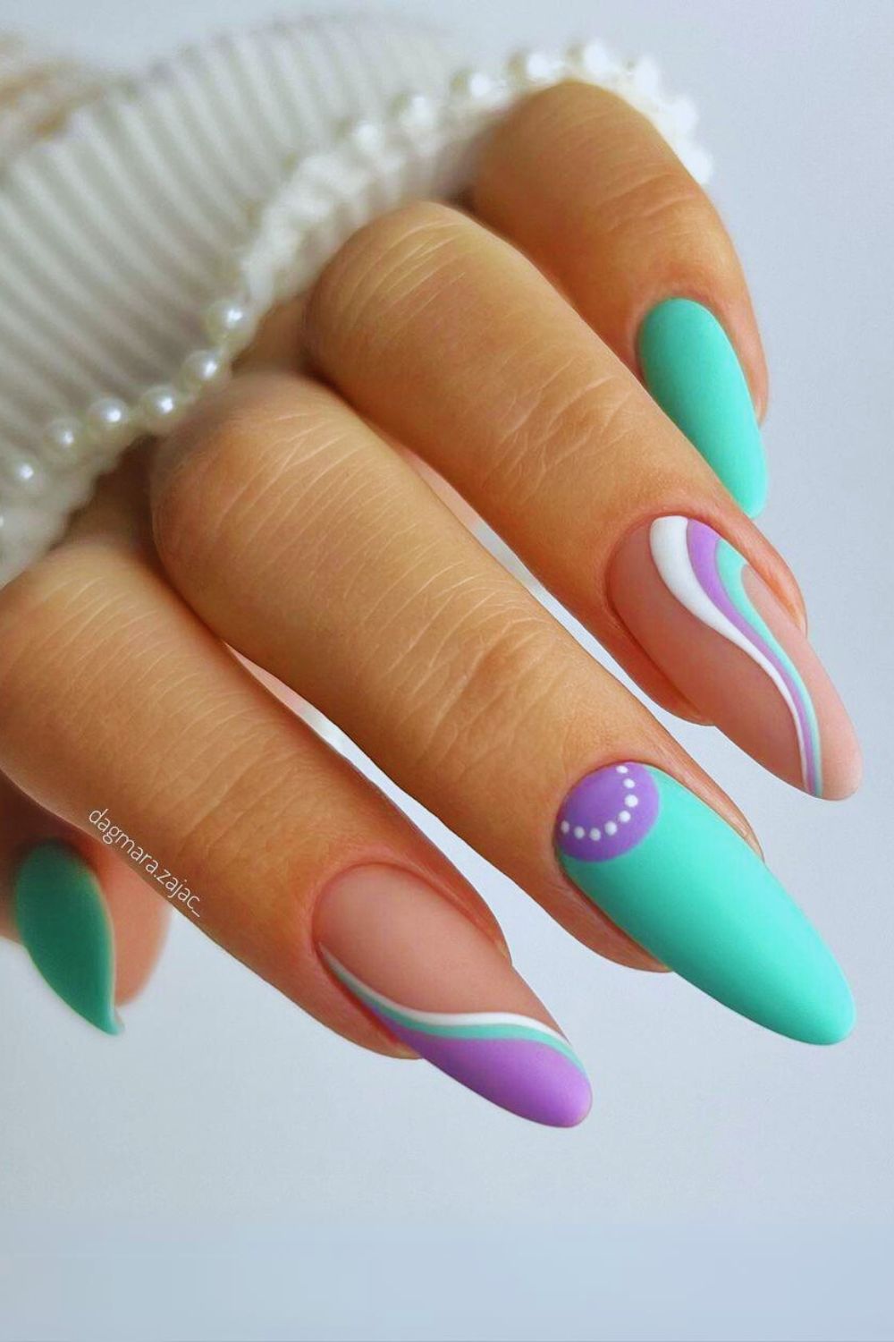 Nails with aqua and purple swirls