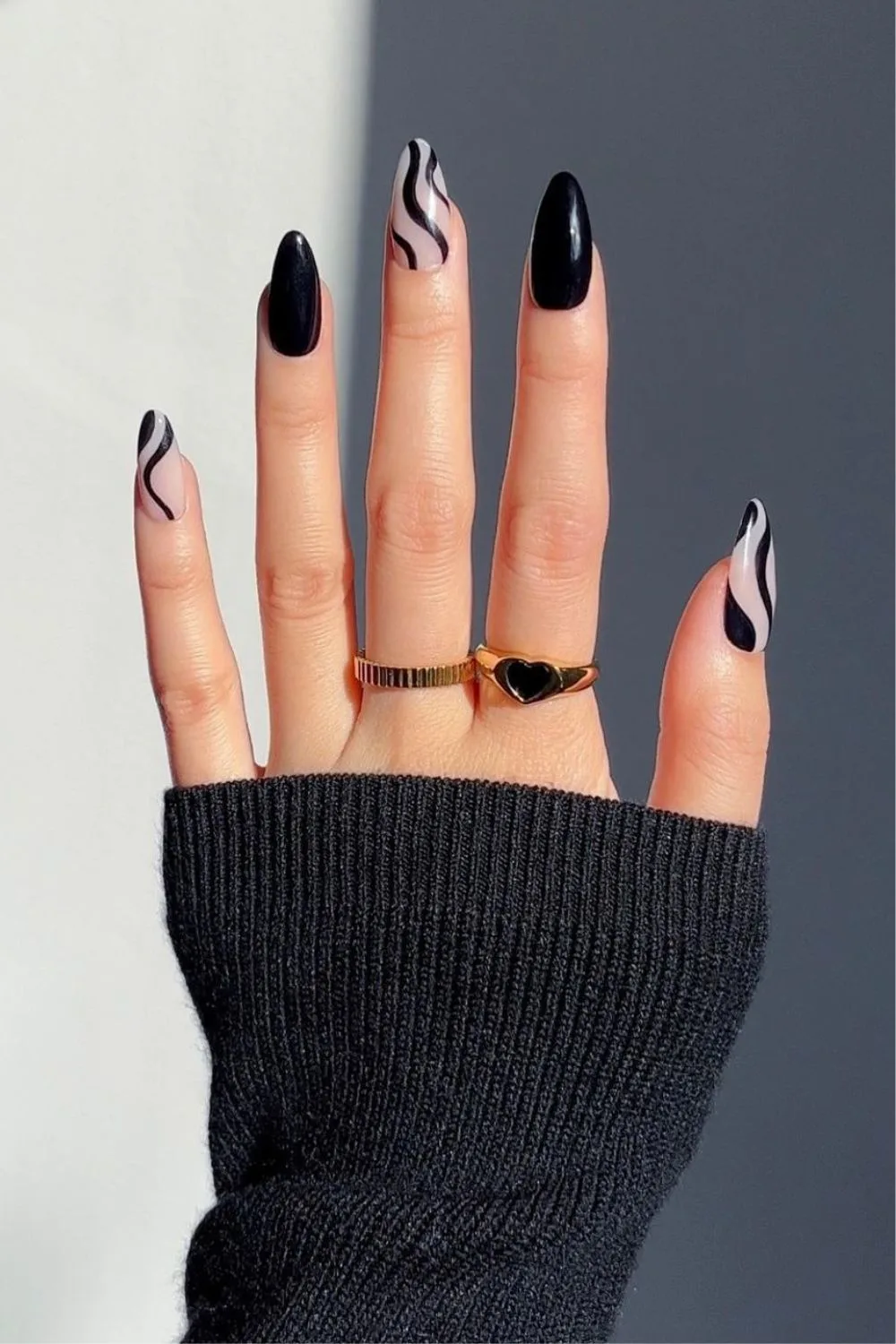 Nails with black swirls