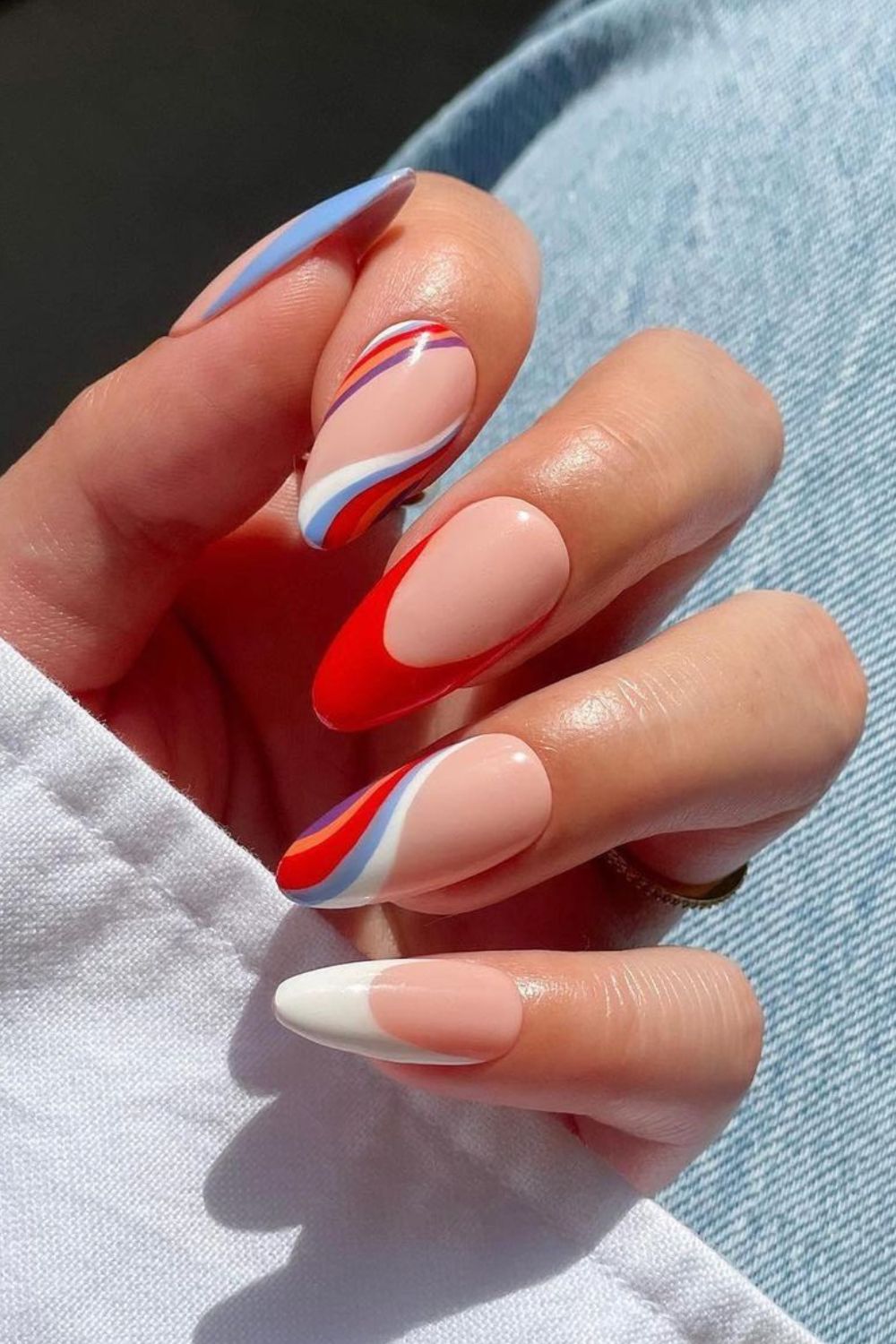 Nails with blue and red swooshes