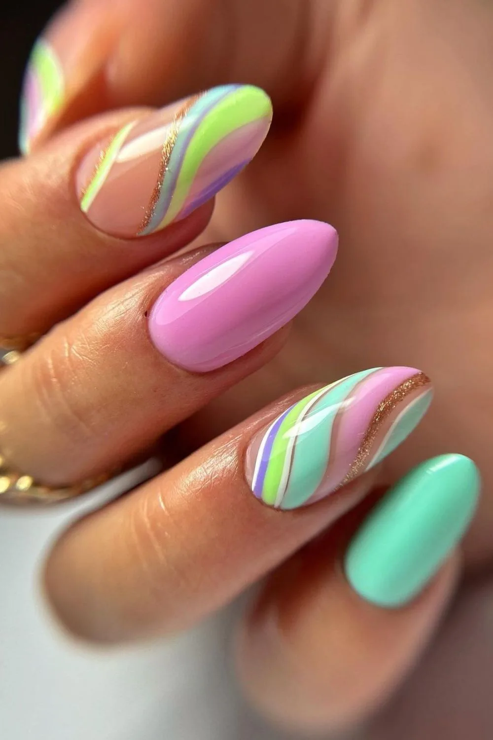 Nails with pink and mint swirls