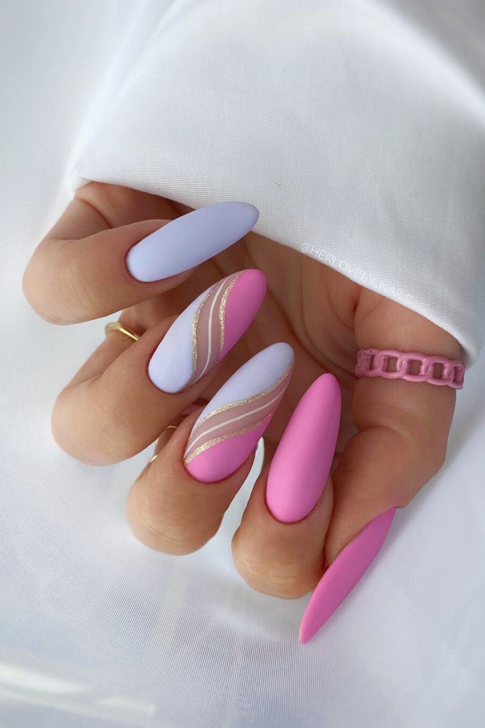 Nails with purple and pink swirls