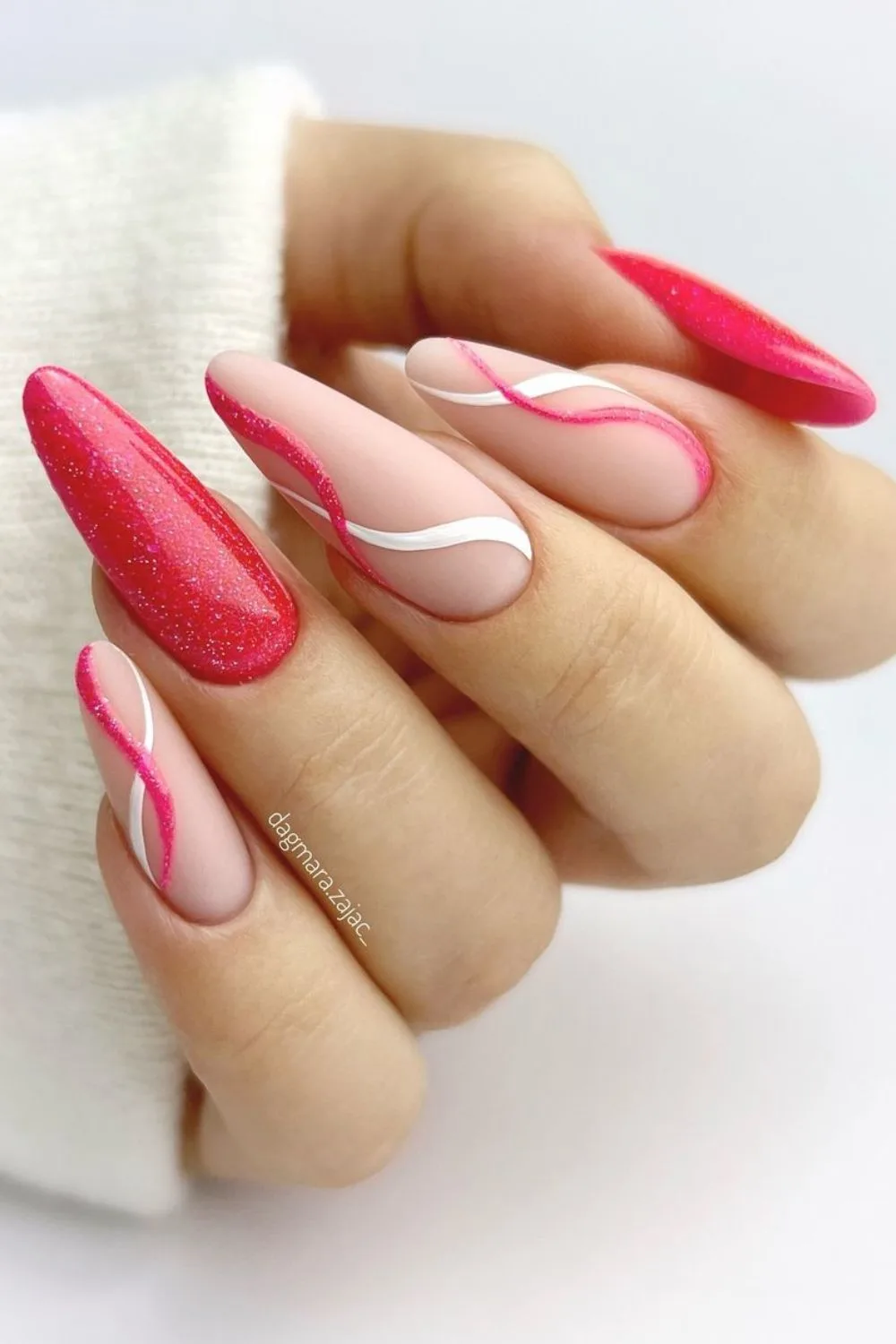 Nails with red and white curves