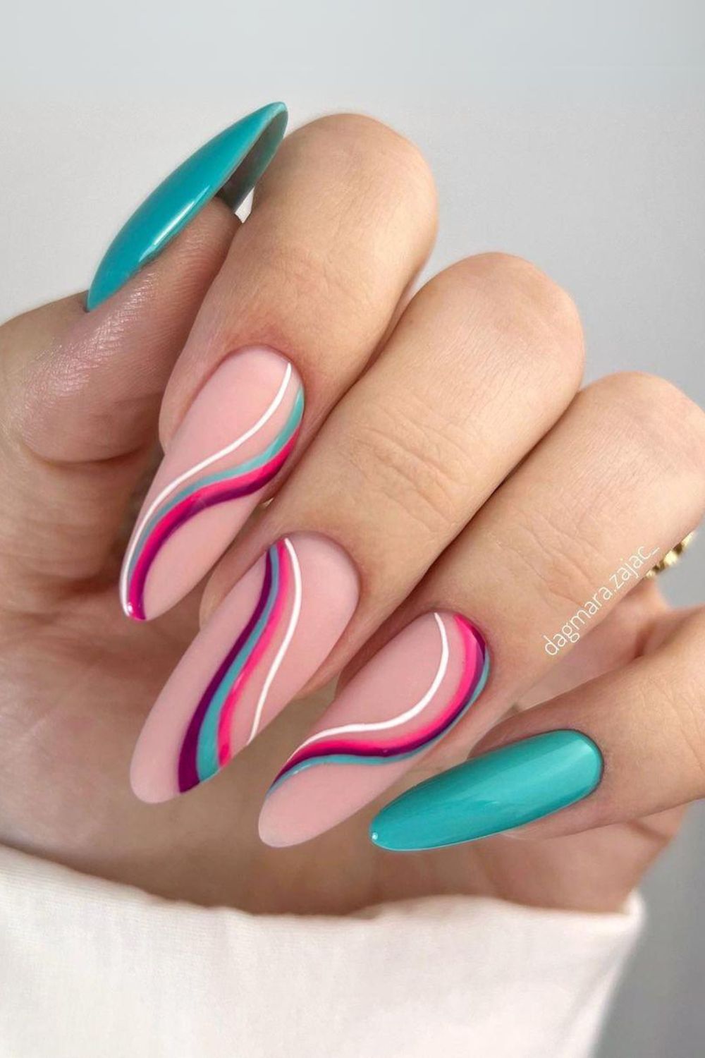 Nails with teal and pink waves