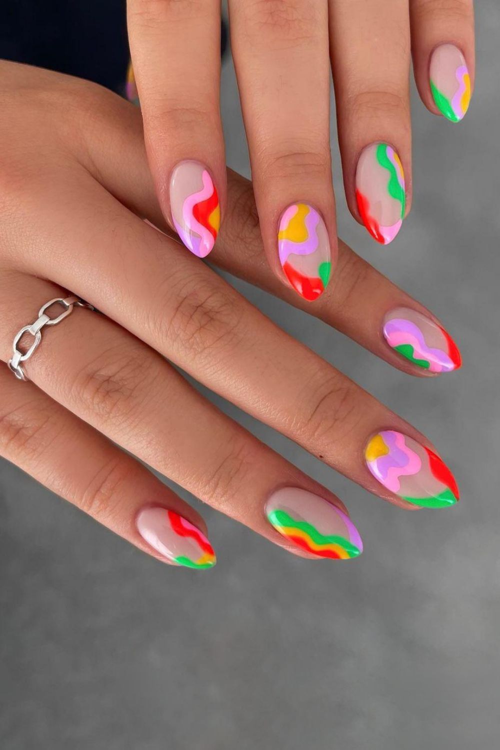 Nails with vibrant neon swirls