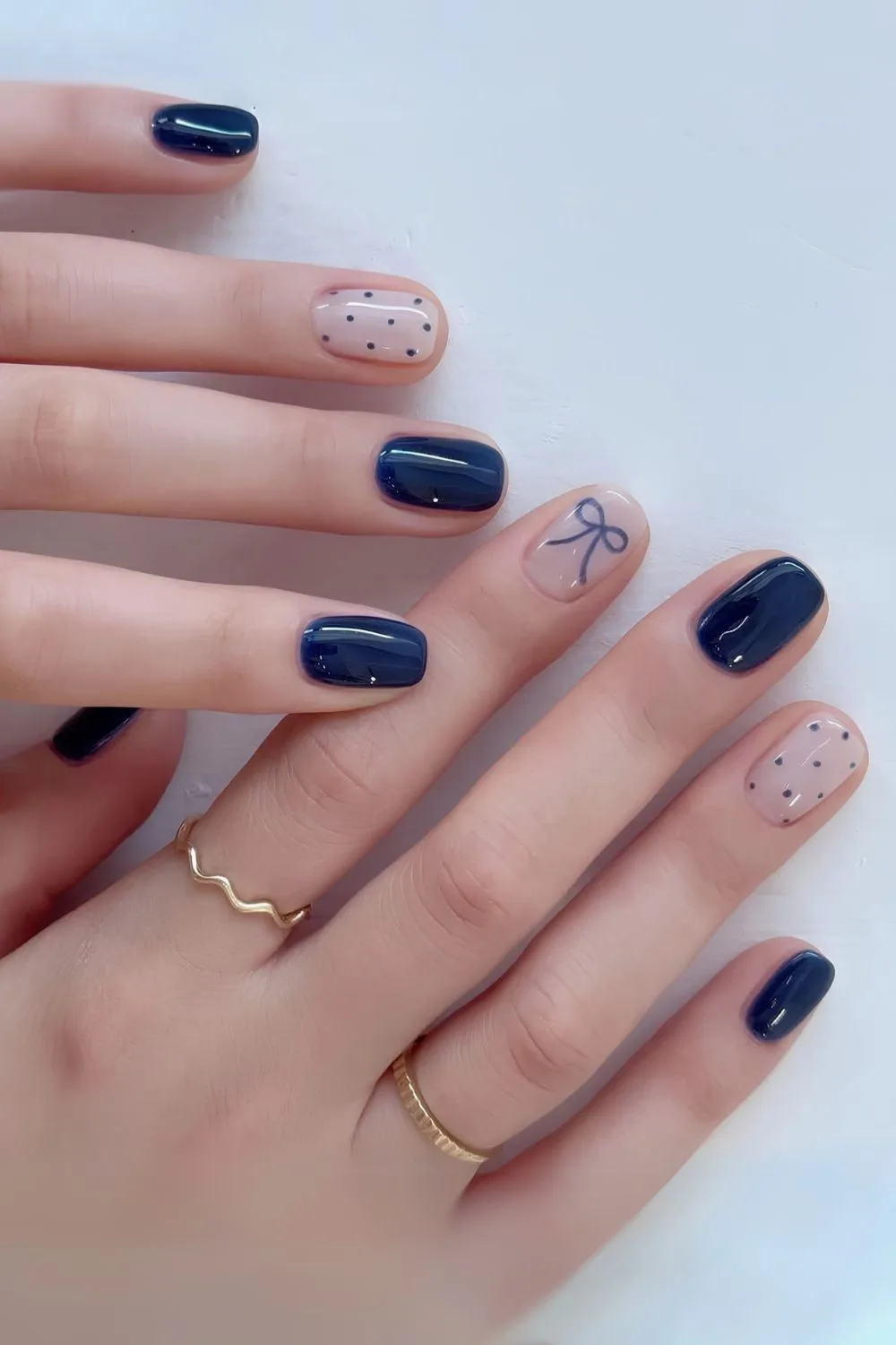 Navy blue coquette manicure