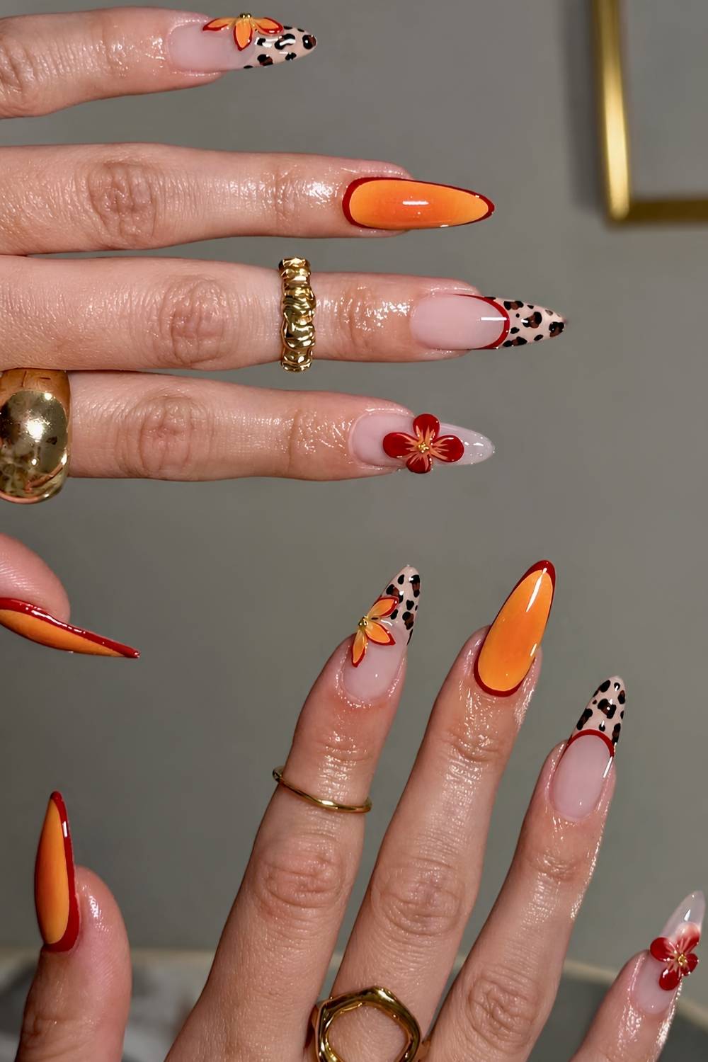 Orange and red nails with leopard print