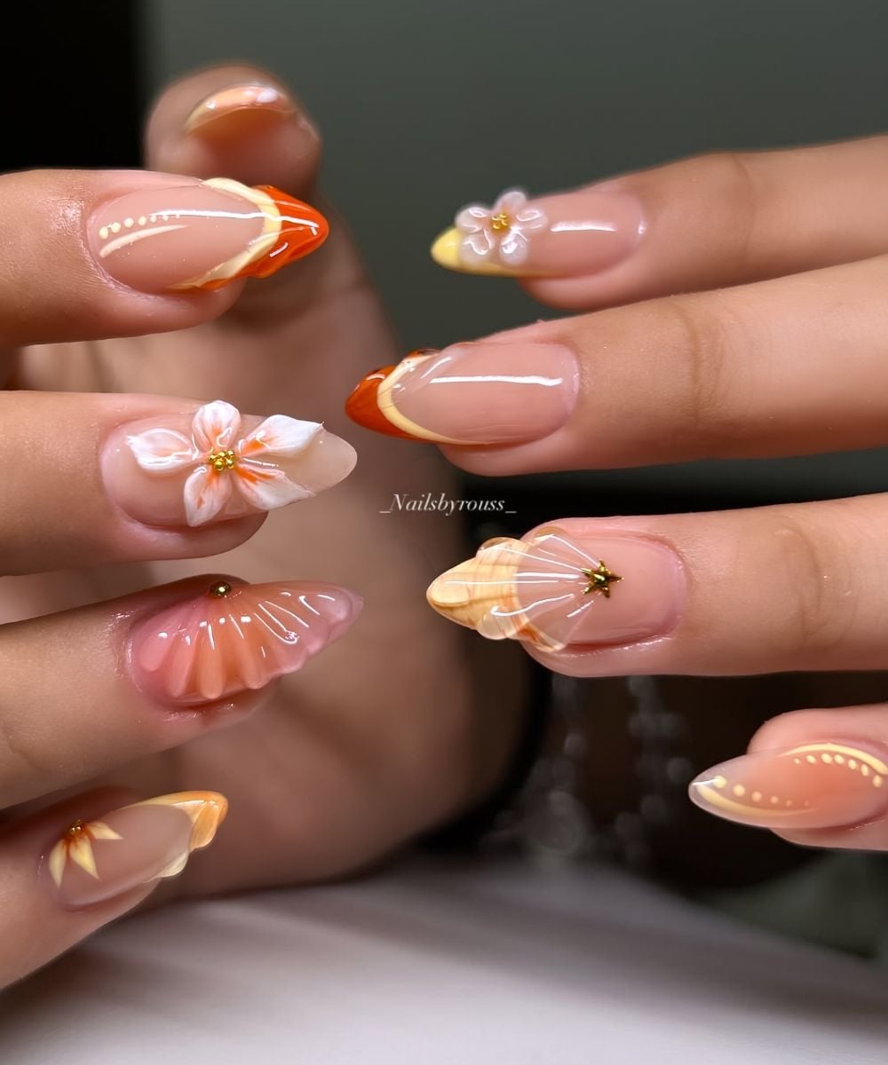 Orange and yellow nails with textured flowers