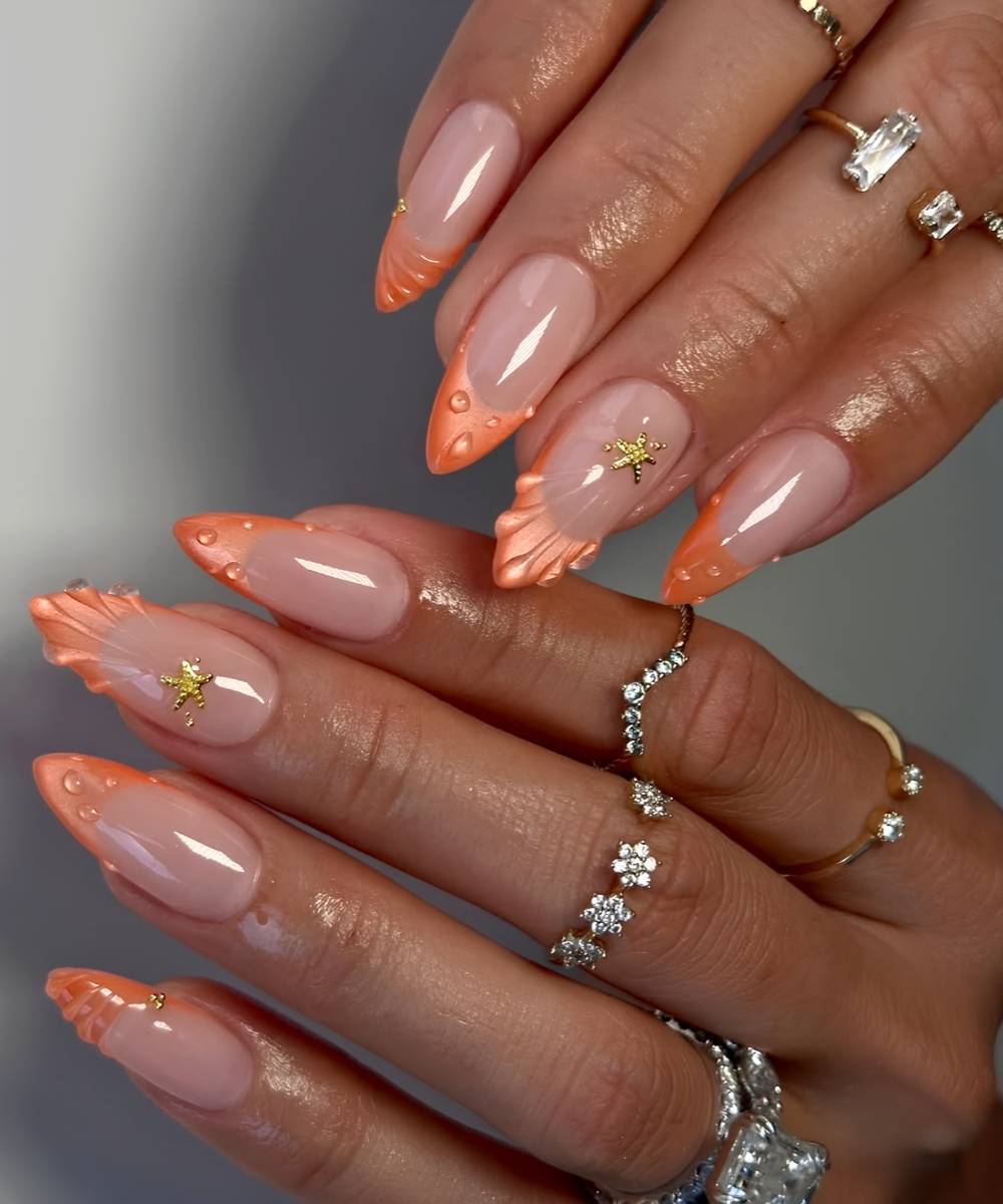 Orange cat eye French nails with accent starfish