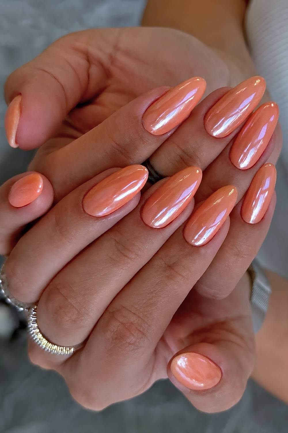Orange chrome effect manicure