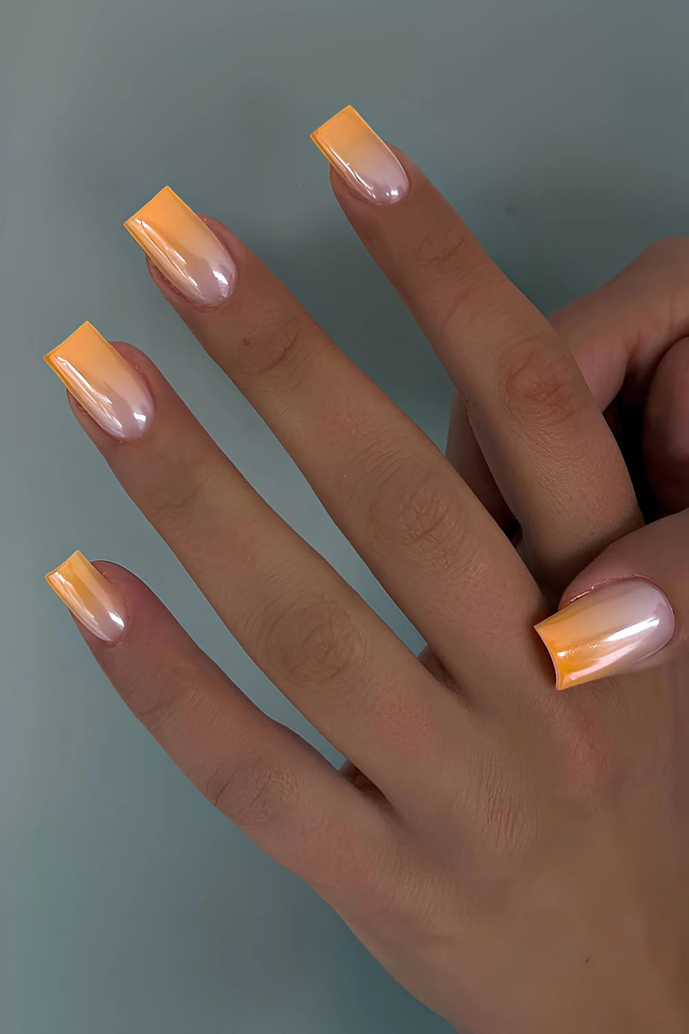 Orange chrome ombre nails