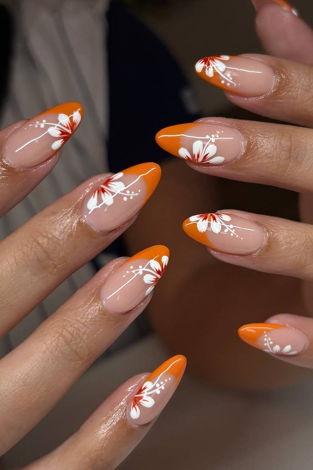Orange french tips with hibiscus flowers