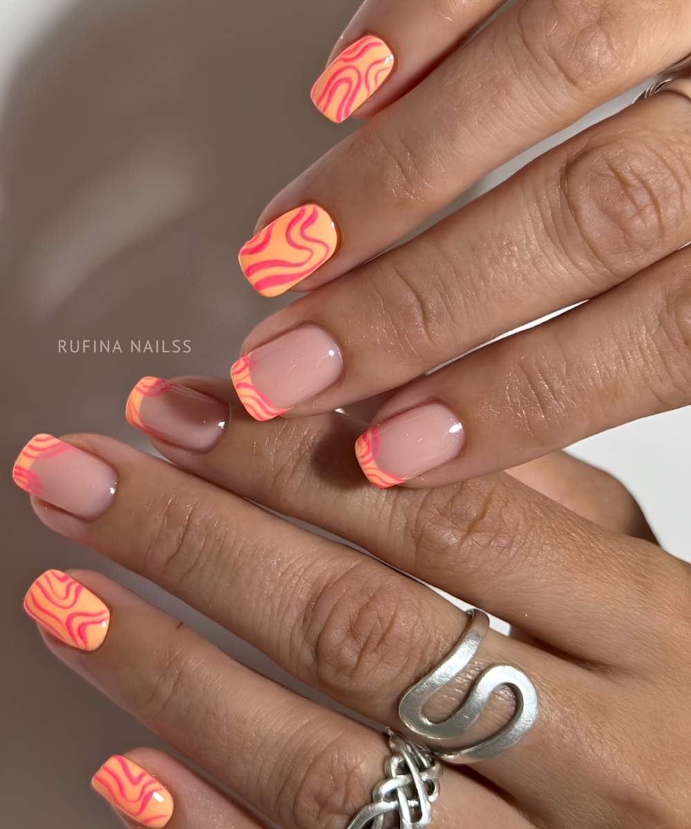 Orange mani with freeform pink swirls
