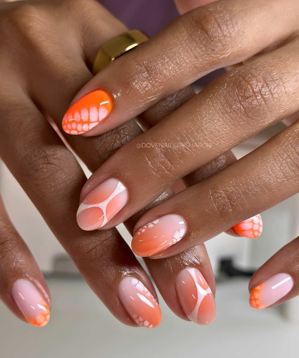 Orange nails with animal print and line art